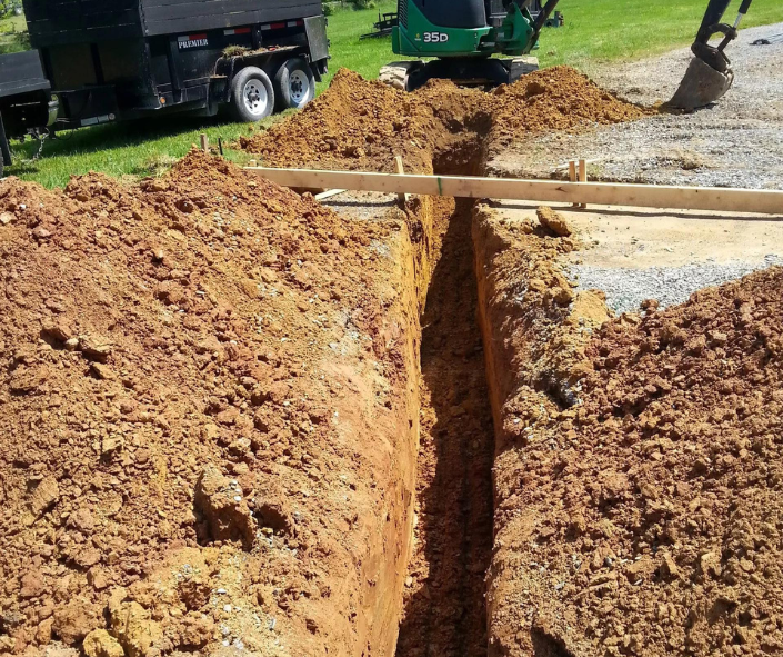 a narrow trench for pipes